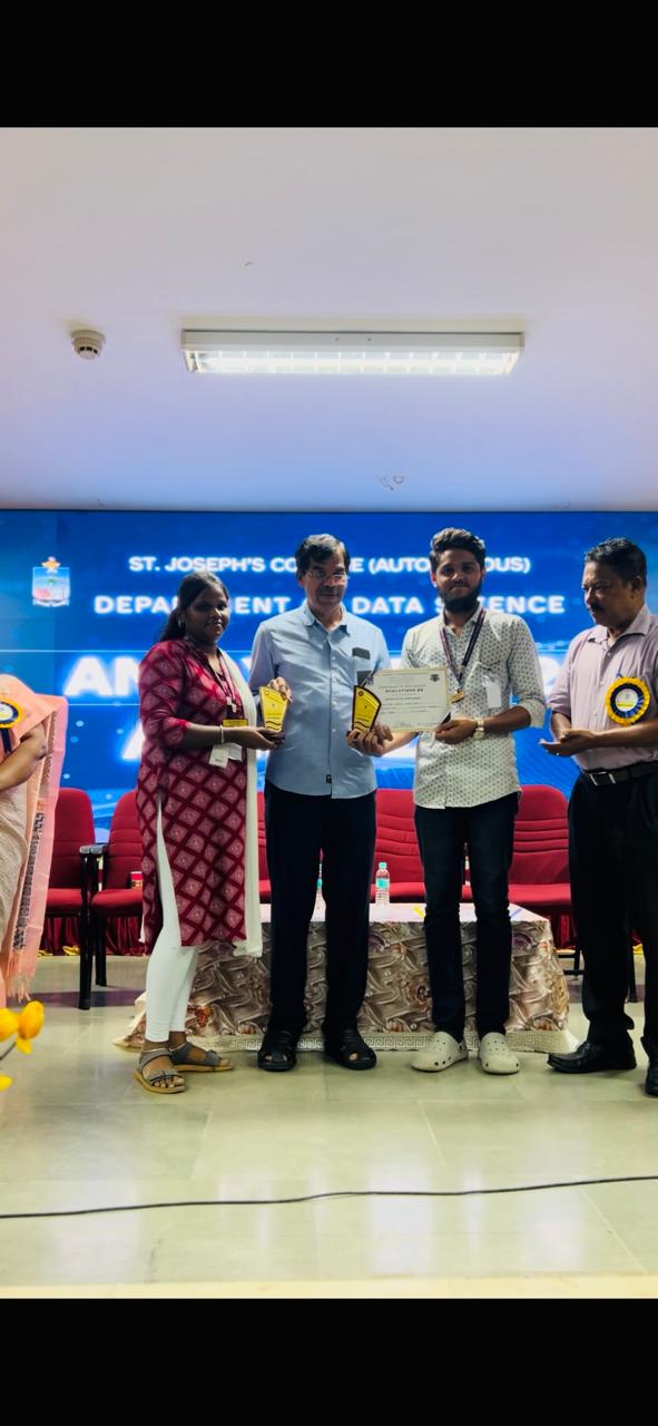 Receiving 2nd place award at a programming competition at St. Joseph's College